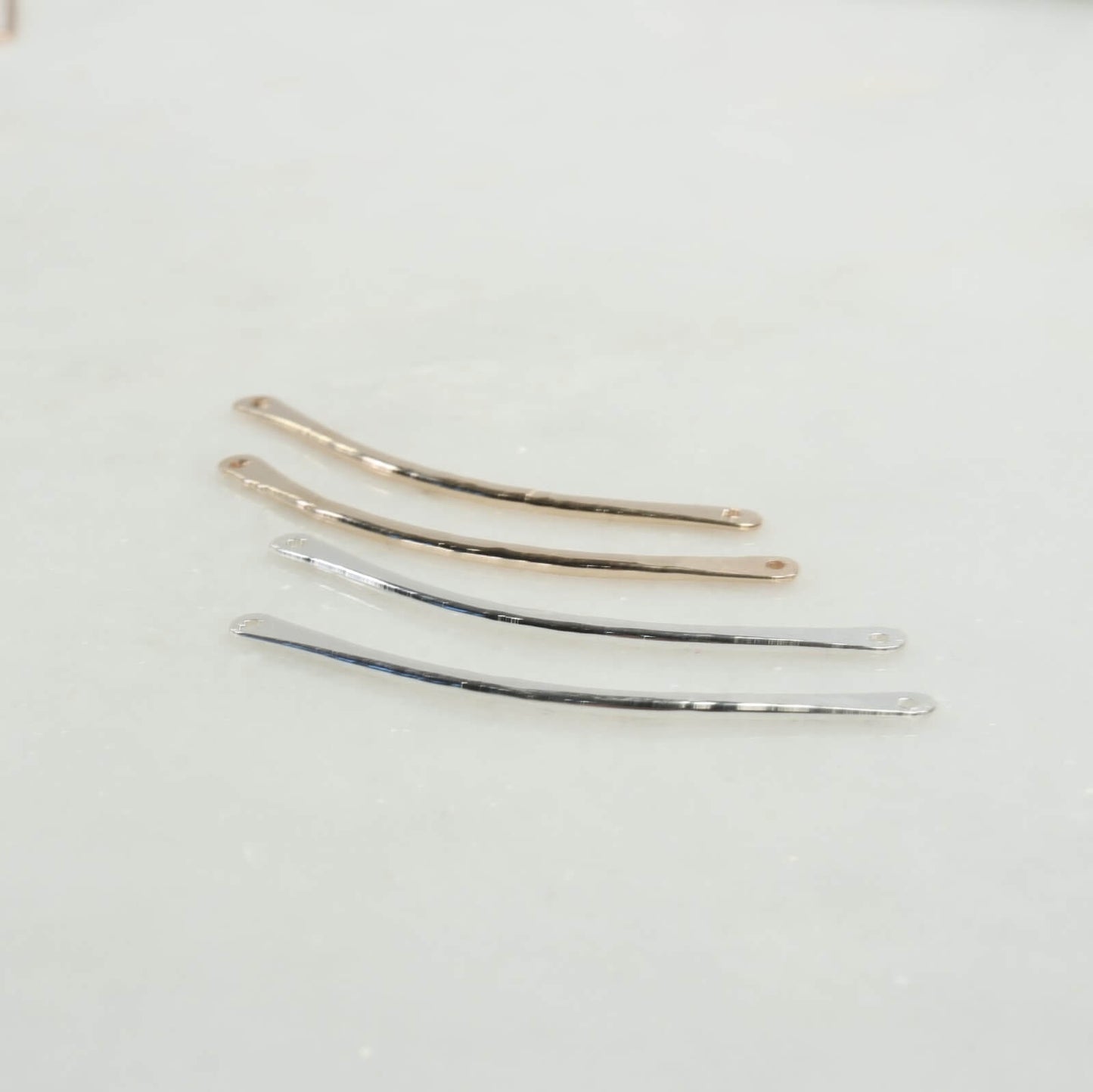 4 bent bars gold and silver